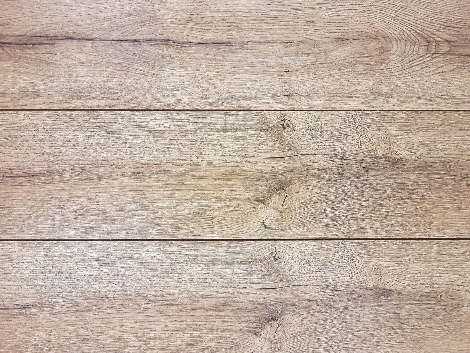 Close-up of golden-toned engineered hardwood planks
