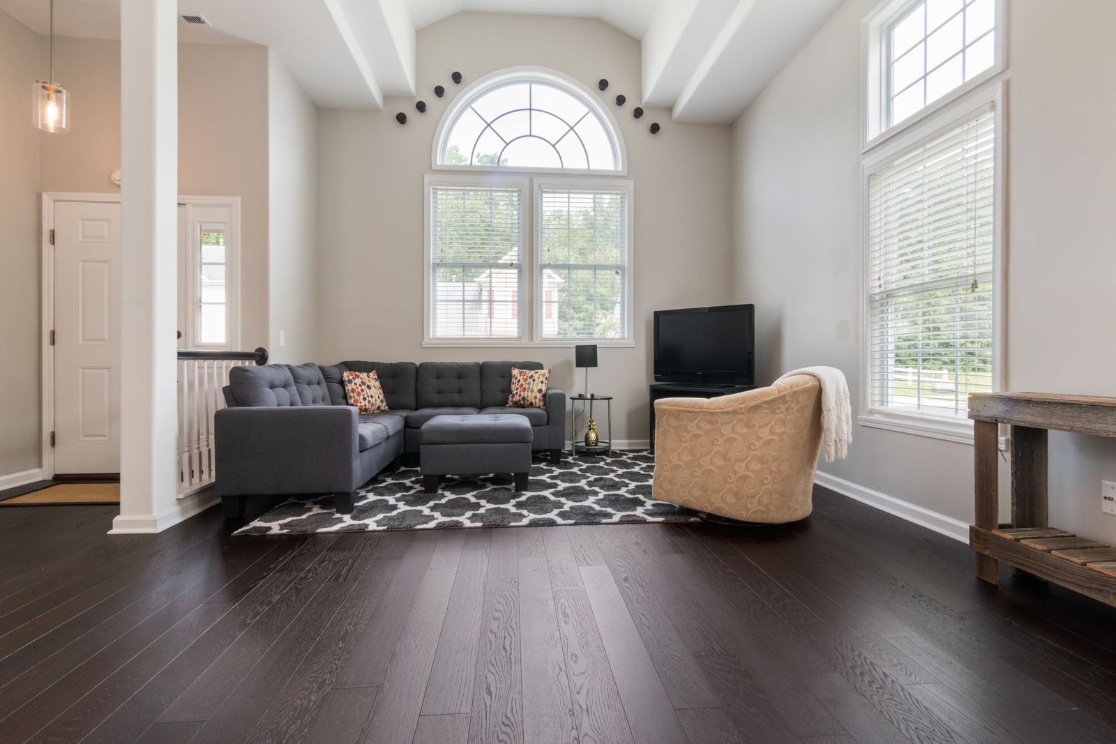 Living room with warm hardwood floors and natural light — flooring near Raleigh, NC