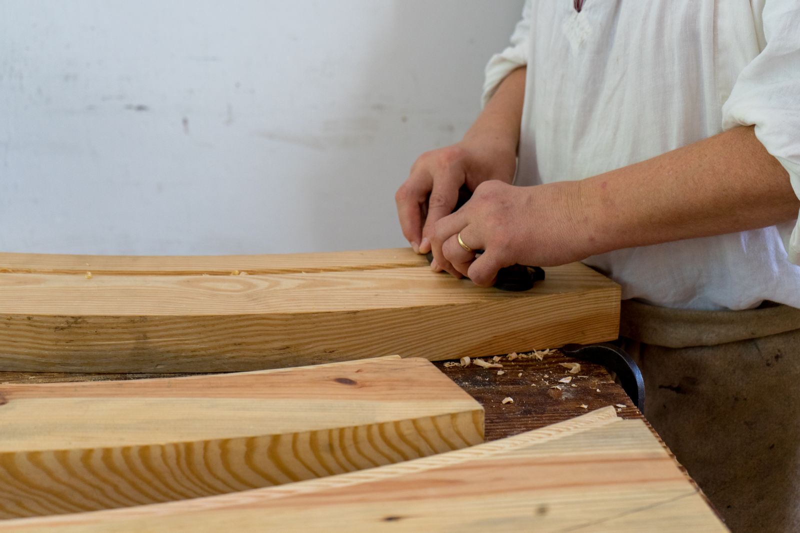 Hand-sanding a hardwood floor during refinishing