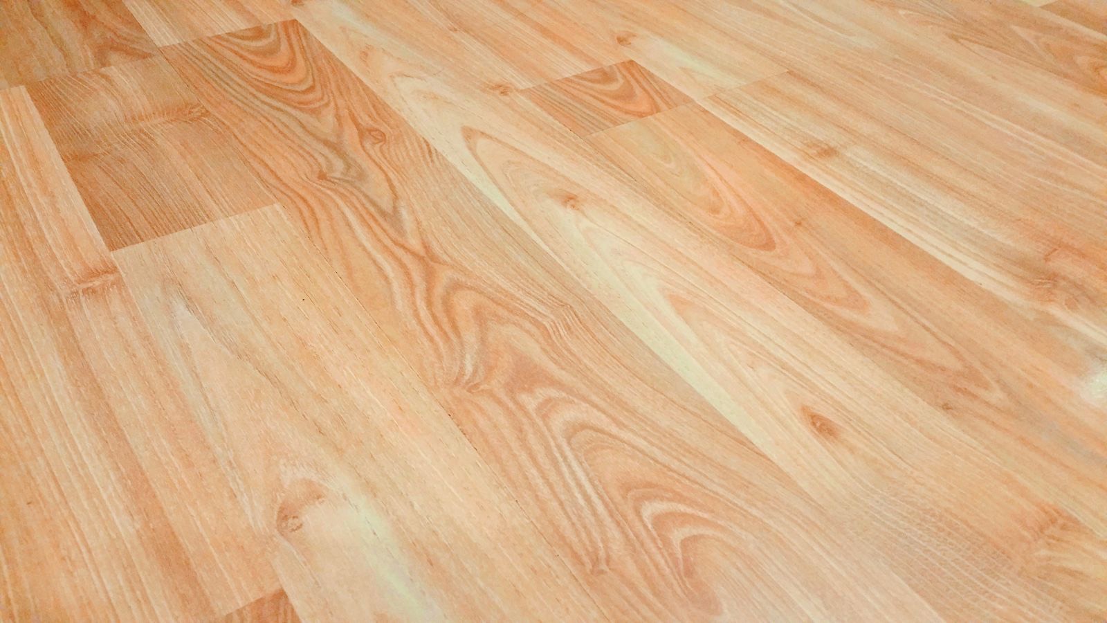Warm honey-toned wood-look luxury vinyl plank